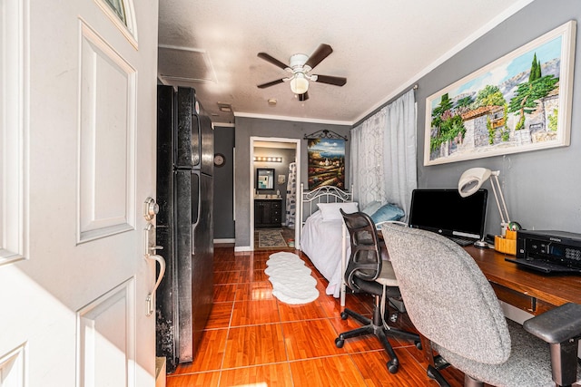 office area with crown molding, baseboards, ceiling fan, wood finished floors, and a textured ceiling