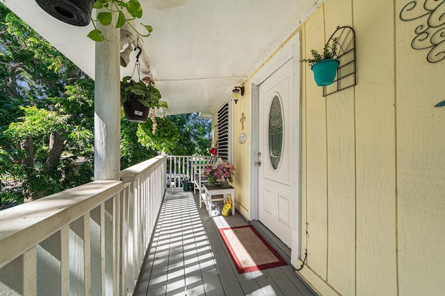 view of exterior entry with covered porch