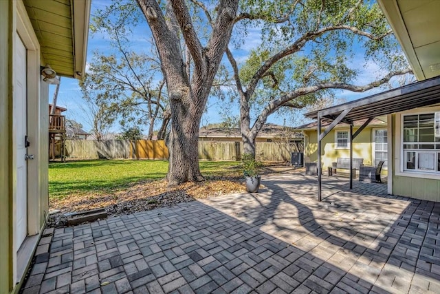 view of patio with cooling unit and a fenced backyard