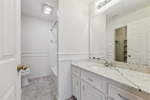 bathroom with tile patterned floors, visible vents, toilet, bathing tub / shower combination, and vanity