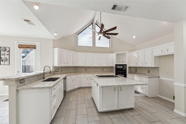 kitchen with visible vents, white cabinets, black appliances, a ceiling fan, and a sink