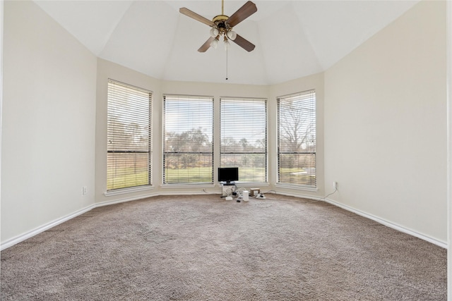 carpeted spare room with baseboards, lofted ceiling, and a ceiling fan