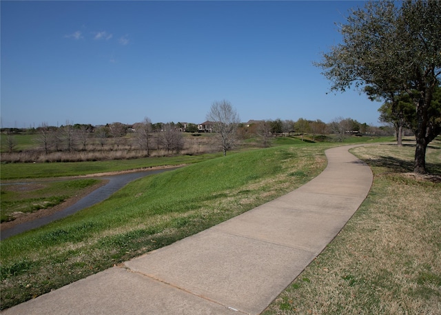 surrounding community with a yard