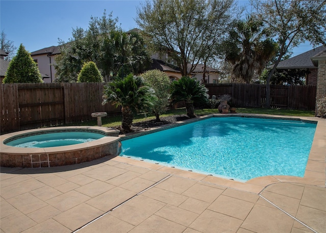 view of pool with a patio, a fenced backyard, and a pool with connected hot tub