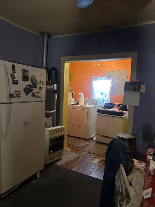 laundry area with heating unit, washer / clothes dryer, laundry area, and water heater