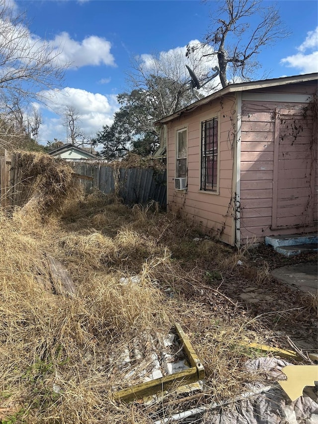 view of side of property with fence