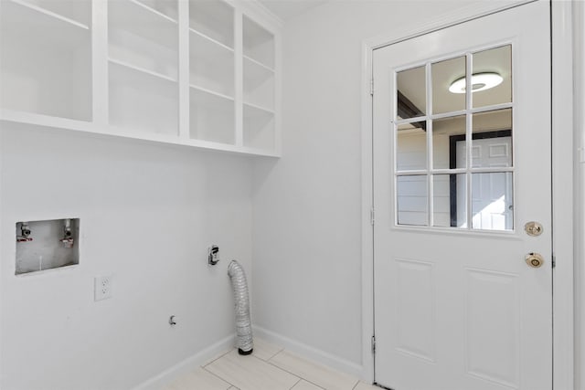 laundry area featuring light tile patterned flooring, baseboards, hookup for an electric dryer, hookup for a washing machine, and laundry area