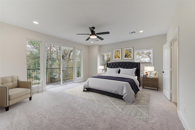 bedroom with access to exterior, visible vents, multiple windows, and recessed lighting