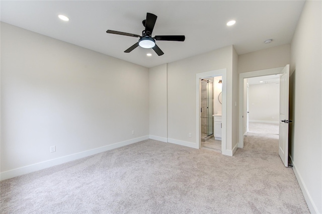 unfurnished bedroom with light colored carpet, recessed lighting, and baseboards