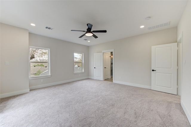 unfurnished bedroom featuring baseboards, visible vents, and carpet floors