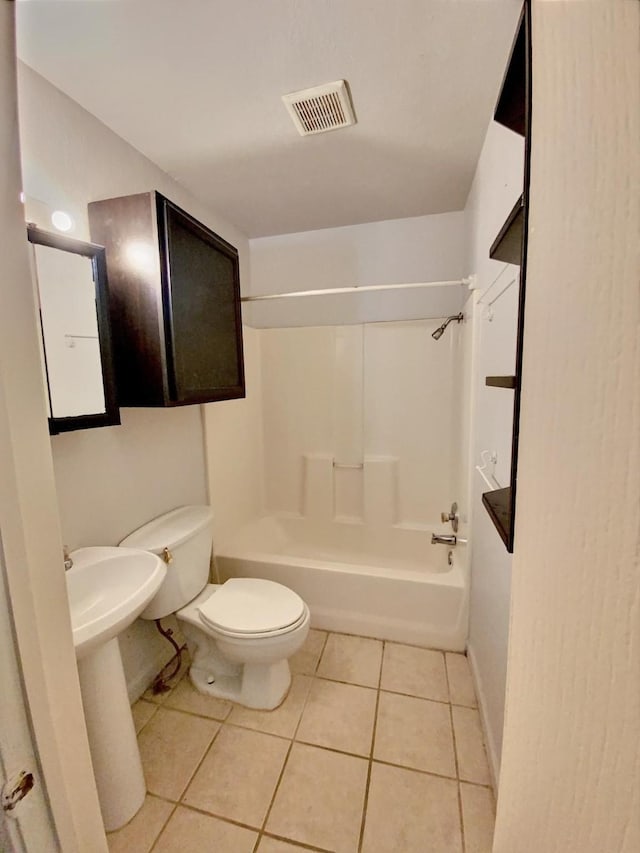 full bath with visible vents, baseboards, toilet, shower / bath combination, and tile patterned floors