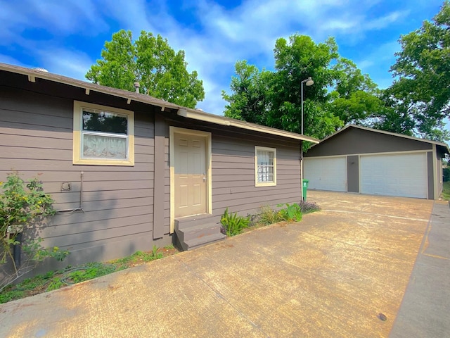 132 Grothe Ln, Houston, TX 77022 - view of front of property featuring entry steps, a garage, and an outbuilding