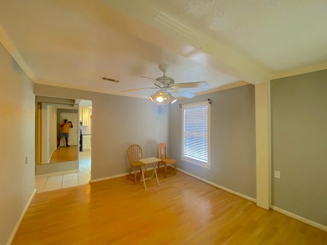 132 Grothe Ln, Houston, TX 77022 - unfurnished room featuring light wood-style floors, baseboards, a ceiling fan, and crown molding