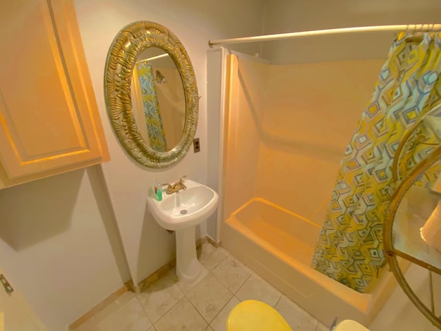 132 Grothe Ln, Houston, TX 77022 - full bathroom with shower / bath combo with shower curtain, tile patterned floors, and baseboards