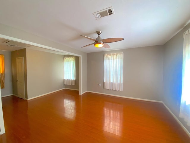 132 Grothe Ln, Houston, TX 77022 - empty room featuring wood finished floors, a ceiling fan, and baseboards