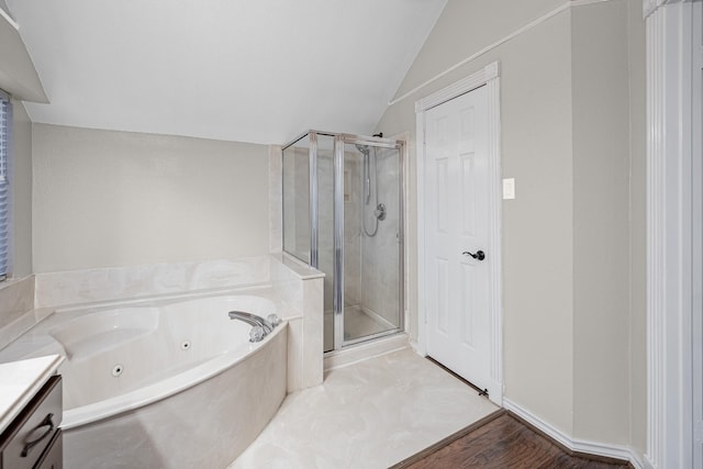 full bath featuring lofted ceiling, a whirlpool tub, vanity, and a shower stall