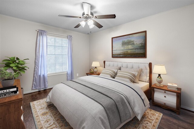 bedroom featuring wood finished floors and a ceiling fan