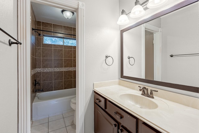 full bathroom with tile patterned floors, toilet, vanity, and bathtub / shower combination