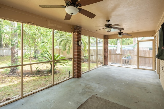 unfurnished sunroom featuring visible vents