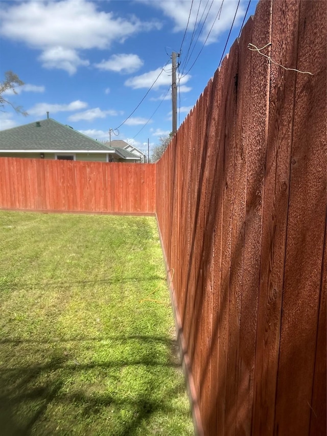 view of yard with a fenced backyard