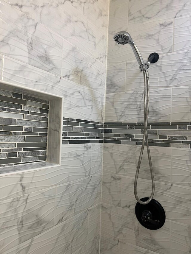 room details with a tile shower