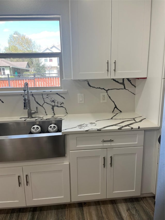 kitchen featuring white cabinetry, light countertops, and dark wood-type flooring