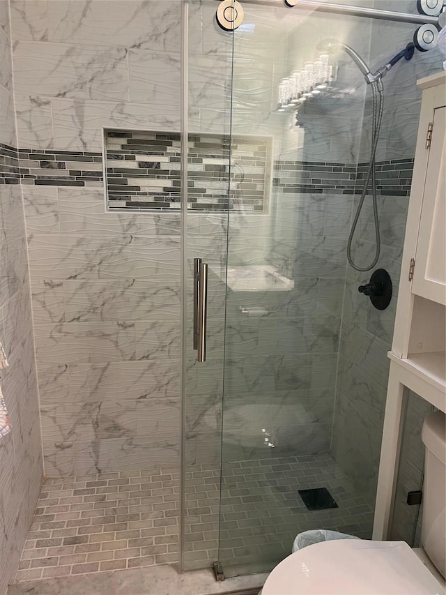 full bath featuring a shower stall