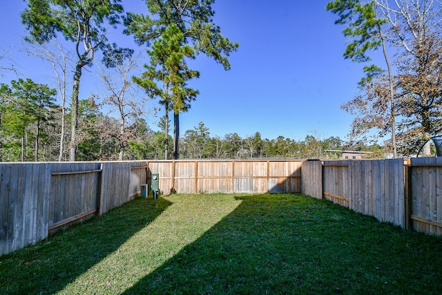 view of yard with a fenced backyard