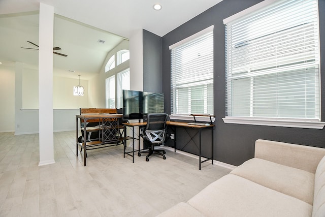 office featuring ceiling fan, baseboards, wood finished floors, and vaulted ceiling