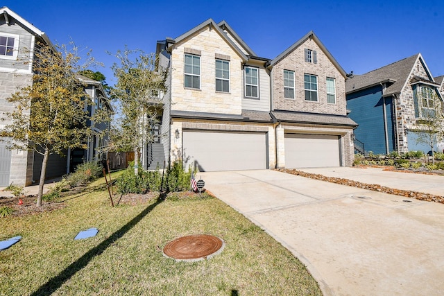 traditional-style home featuring a front lawn, driveway, stone siding, a garage, and brick siding