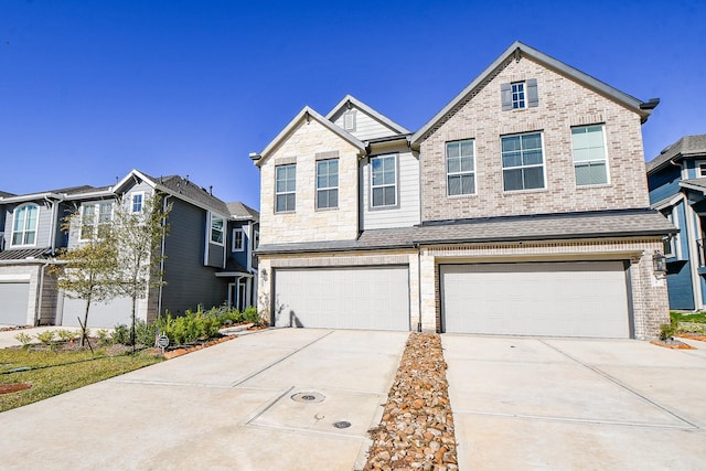 view of front of home featuring driveway, a shingled roof, stone siding, a garage, and brick siding