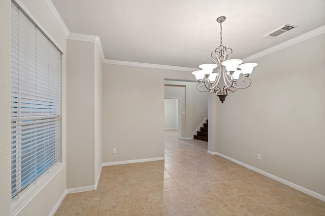 unfurnished room with crown molding, baseboards, and visible vents