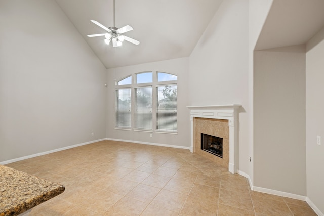 unfurnished living room featuring baseboards, light tile patterned floors, a fireplace, high vaulted ceiling, and a ceiling fan