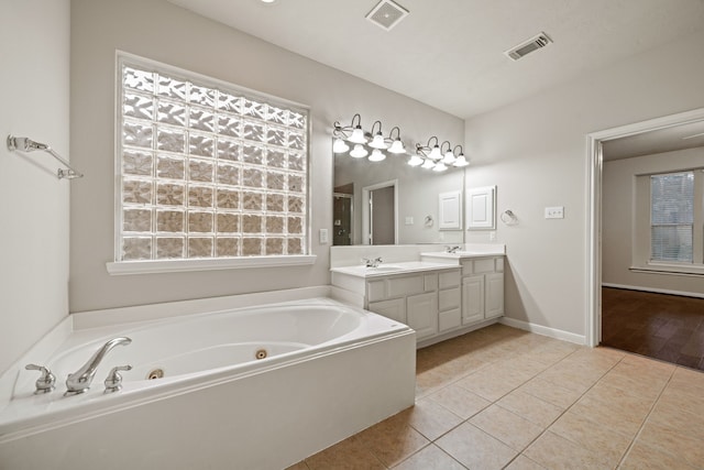 full bath featuring tile patterned floors, visible vents, and a sink