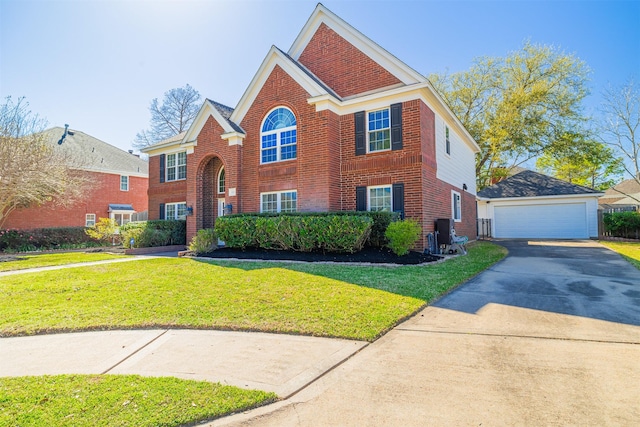 view of front of house with an outdoor structure, brick siding, a detached garage, and a front lawn