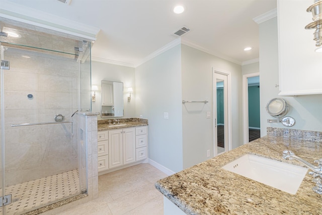 full bathroom with a stall shower, ornamental molding, visible vents, and a sink