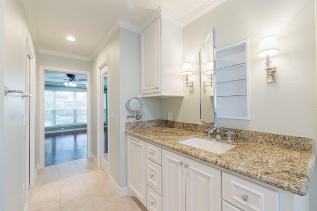 bathroom featuring vanity, baseboards, recessed lighting, tile patterned flooring, and crown molding