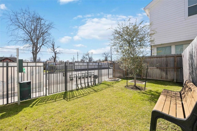 view of yard with a fenced backyard