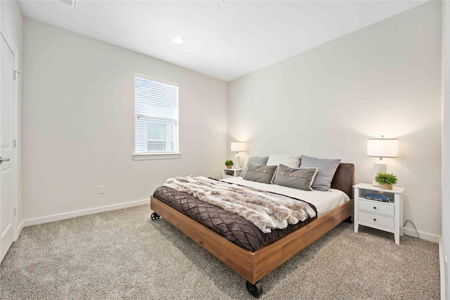 bedroom with carpet flooring and baseboards