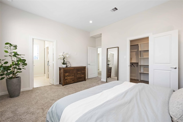 carpeted bedroom with baseboards, visible vents, recessed lighting, a spacious closet, and connected bathroom