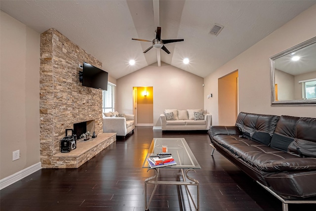 living room featuring visible vents, lofted ceiling with beams, baseboards, and wood finished floors