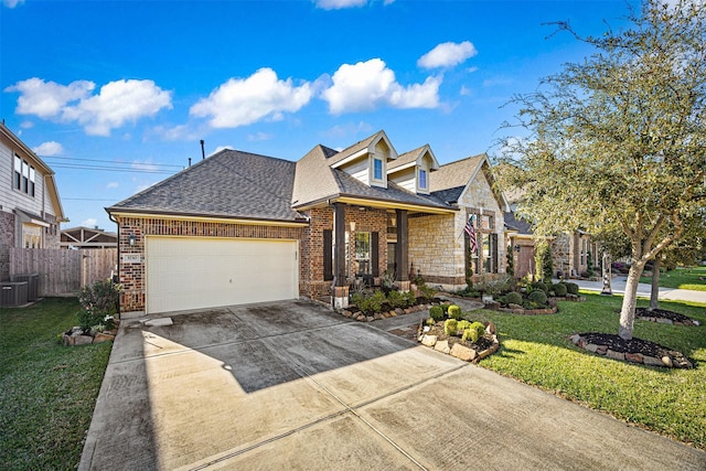 view of front of home featuring driveway, brick siding, a front yard, and fence