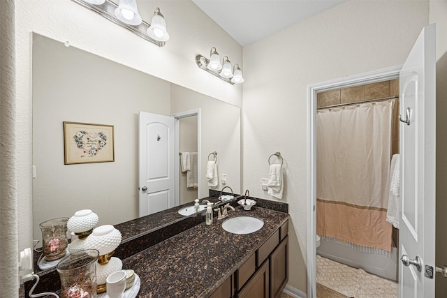 full bath featuring vanity, toilet, and shower / tub combo with curtain