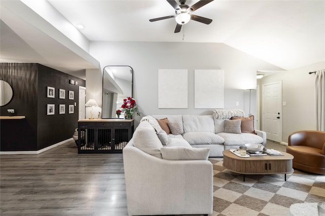 living room with lofted ceiling, wood finished floors, baseboards, and ceiling fan