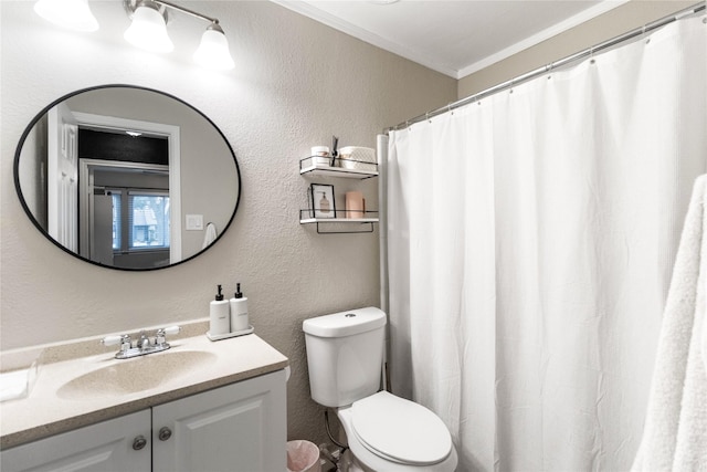 full bathroom with toilet, crown molding, vanity, and a textured wall