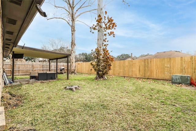 view of yard with an outdoor living space and a fenced backyard