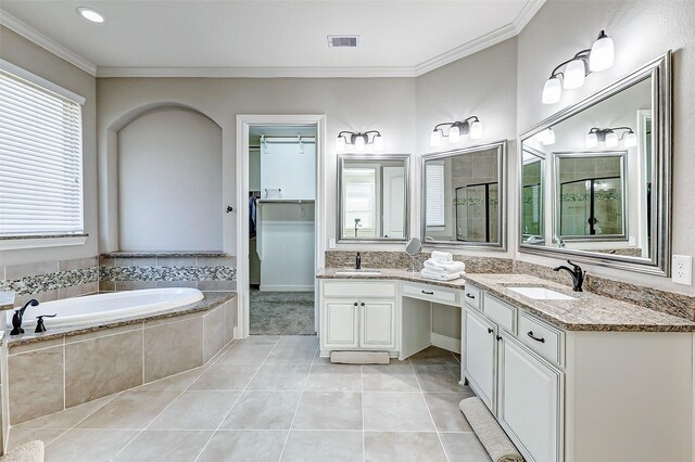 full bath with tile patterned flooring, crown molding, visible vents, and a sink