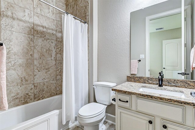 bathroom featuring visible vents, shower / bathtub combination with curtain, toilet, vanity, and a textured wall