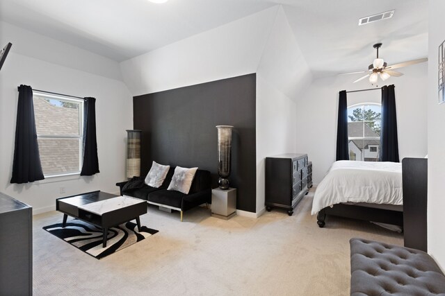 carpeted bedroom with visible vents, baseboards, and lofted ceiling