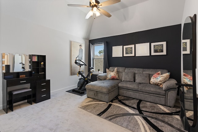 living area featuring lofted ceiling, a ceiling fan, baseboards, and light carpet